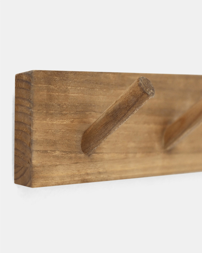 Massiver Wandhaken aus dunklem Eichenholz in der Größe 26x5cm.
