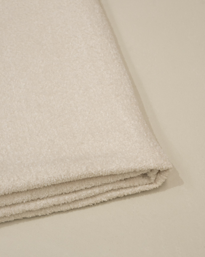 Beige Bouclé-Kopfteilhülle in verschiedenen Größen.