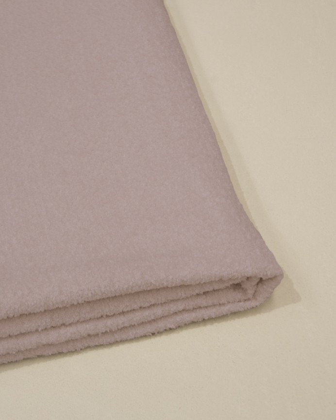 Kopfteilhülle aus rosa Bouclé in verschiedenen Größen.