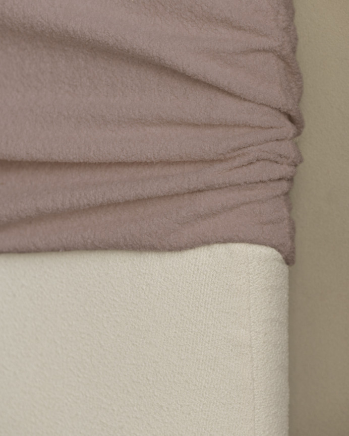 Gepolstertes Kopfteil aus rosa Bouclé in verschiedenen Größen, abnehmbar.