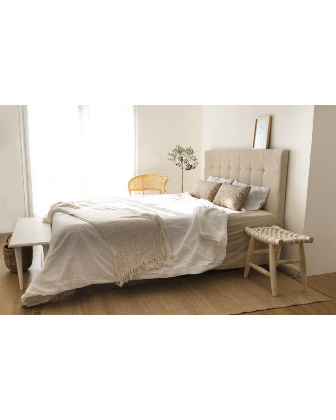 Upholstered polyester headboard with beige pleats in various sizes.