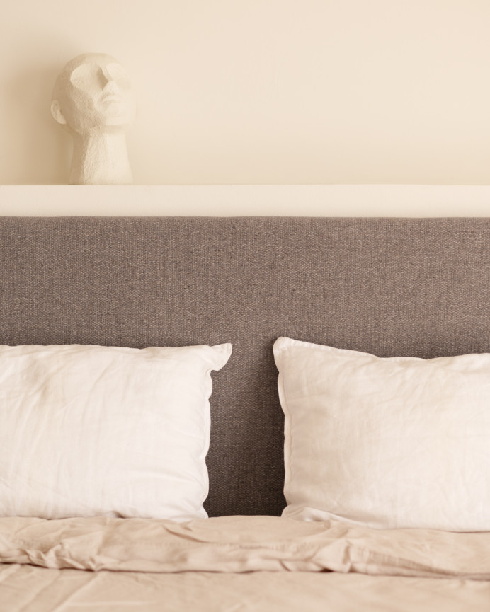 Upholstered polyester headboard in smooth purple color in various sizes.