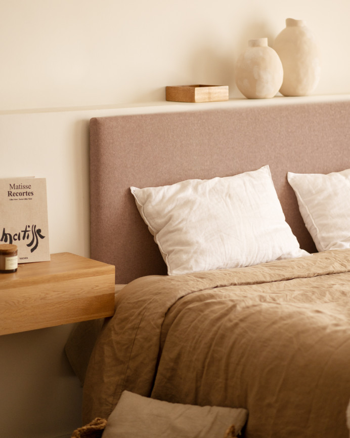 Upholstered headboard in smooth polyester in orange color of various sizes.