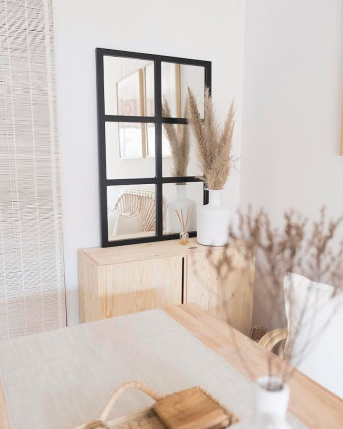 Black wooden mirror measuring 90x60cm.