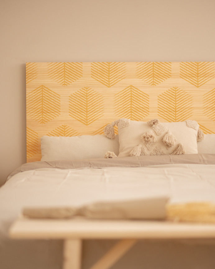 Solid wood headboard stamped with Hexagonal Leaves II pattern in natural tone of various sizes.
