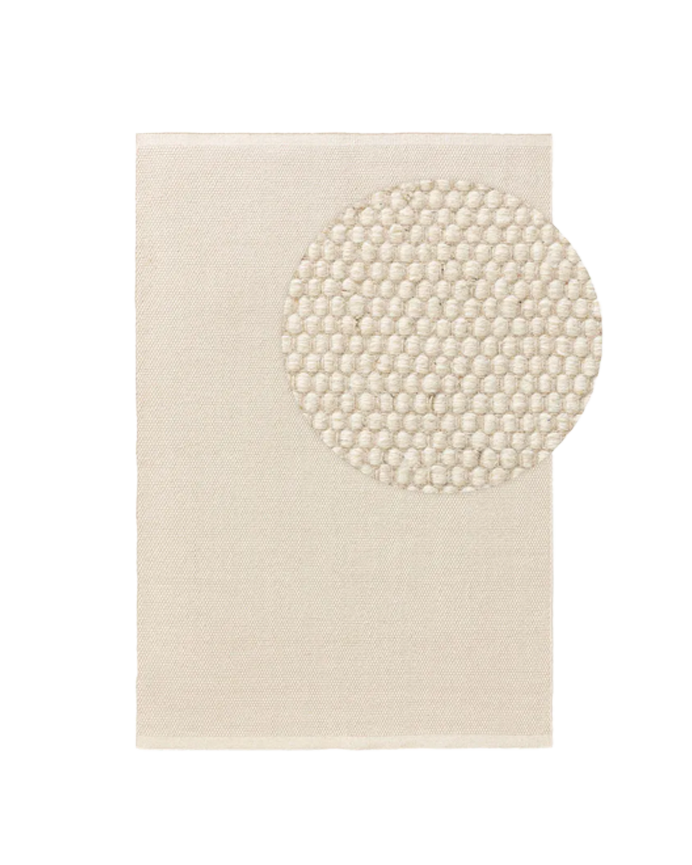 White wool rug in various sizes.