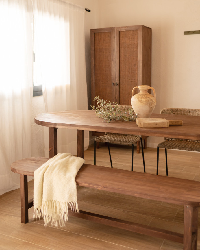 Oval solid wood dining table in walnut tone available in various sizes.