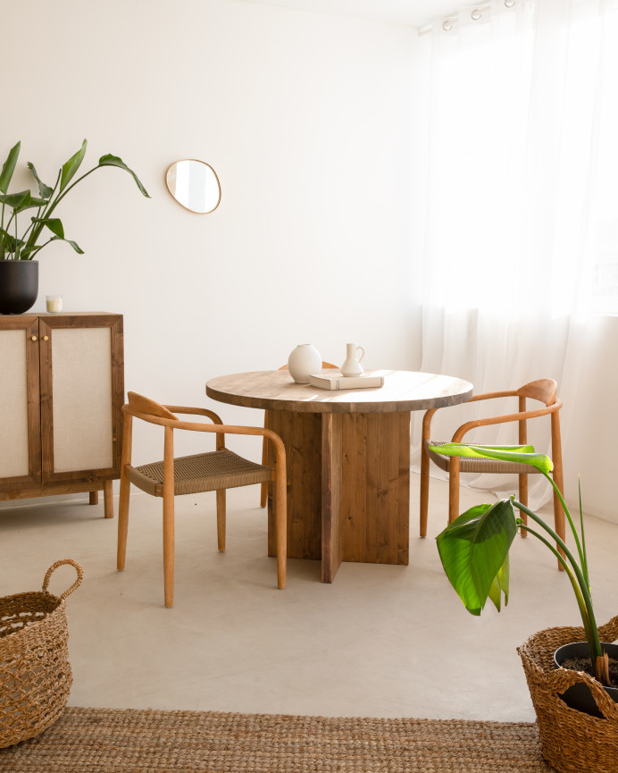 Round solid wood dining table in a dark oak tone with a diameter of 110cm.