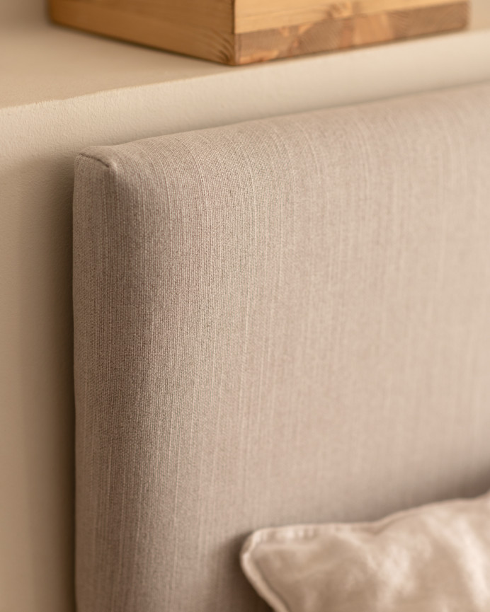 Upholstered headboard in smooth polyester in bone color of various sizes.