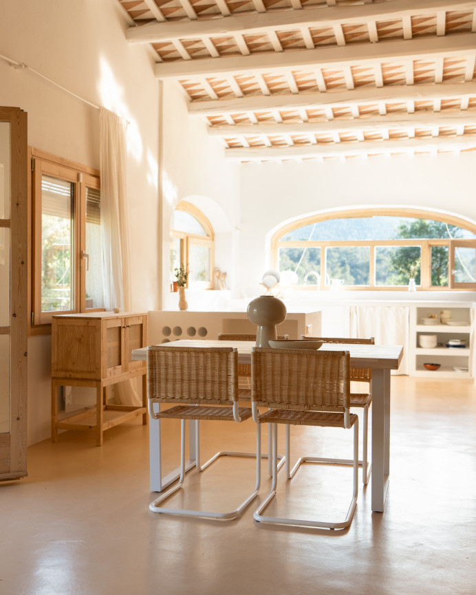Solid wood dining table in natural tone with white iron legs measuring 140x80cm.