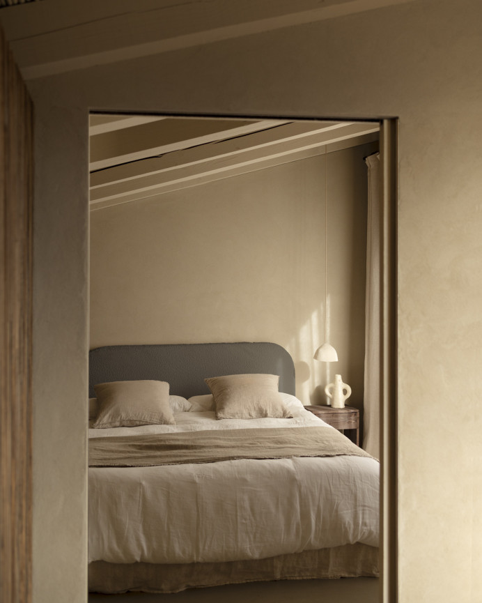 Removable dark gray bouclé upholstered headboard available in various sizes.