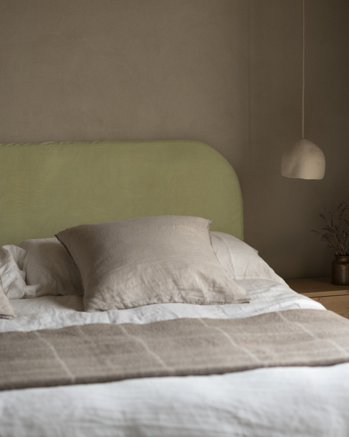 Upholstered headboard with removable lime corduroy cover in various sizes.