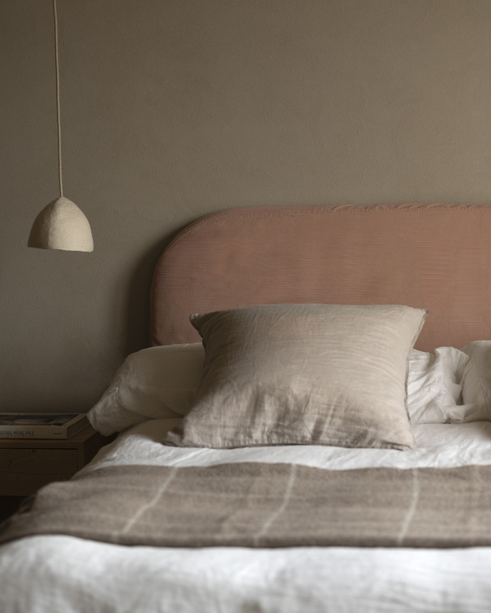Upholstered headboard with removable coral corduroy cover, available in various sizes.