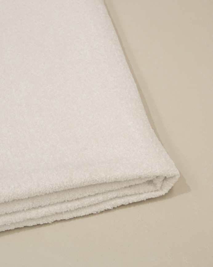 White bouclé headboard cover in various sizes.