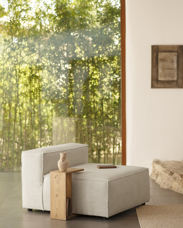 Light gray bouclé armchair measuring 110x90cm.