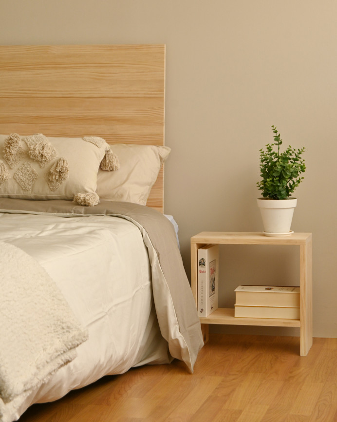 Solid wood bedside table in a natural tone measuring 40x20cm