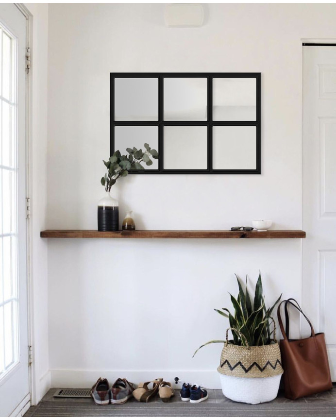 Black wooden mirror measuring 90x60cm.
