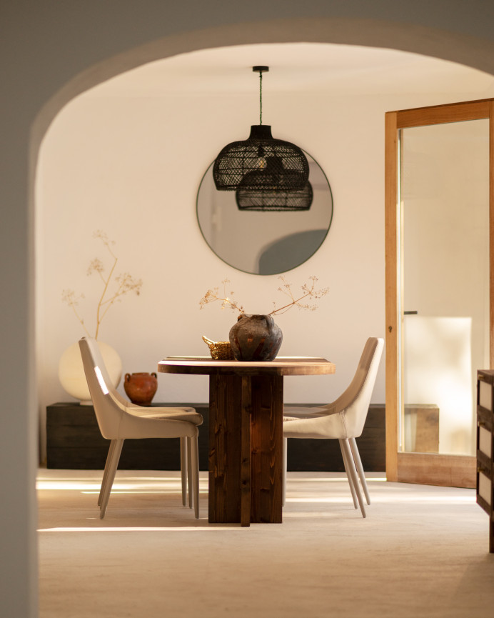 Solid oval dining table made of walnut wood in various sizes.