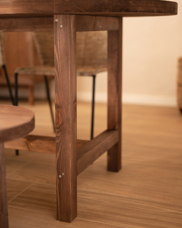 Oval solid wood dining table in walnut tone available in various sizes.