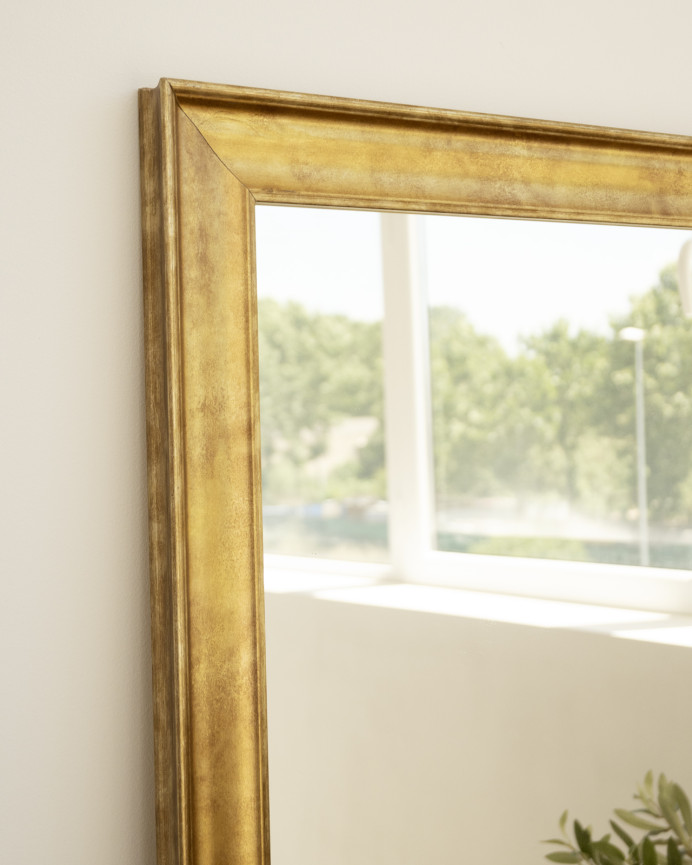 Solid wood mirror in a gold finish with a rectangular shape available in various sizes.