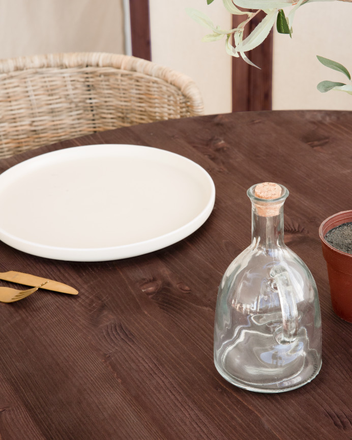 Solid walnut round dining table with a diameter of 110 cm.