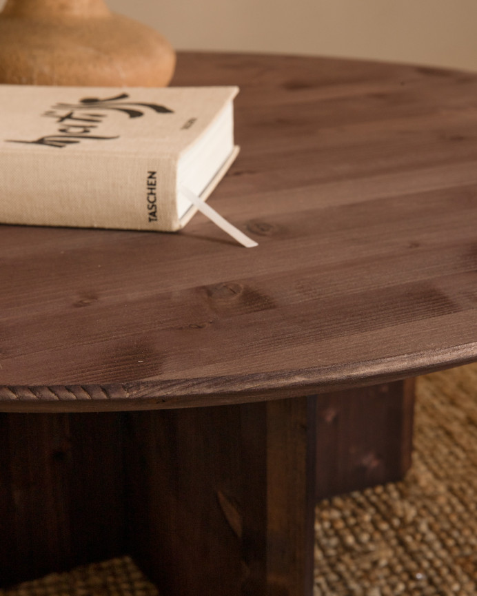 Round solid wood coffee table in walnut tone, available in various sizes.