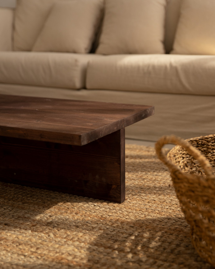 Solid wood walnut-toned coffee table measuring 124x27cm.