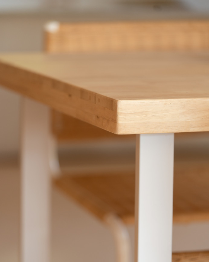 Solid wood dining table in natural tone with white iron legs measuring 140x80cm.