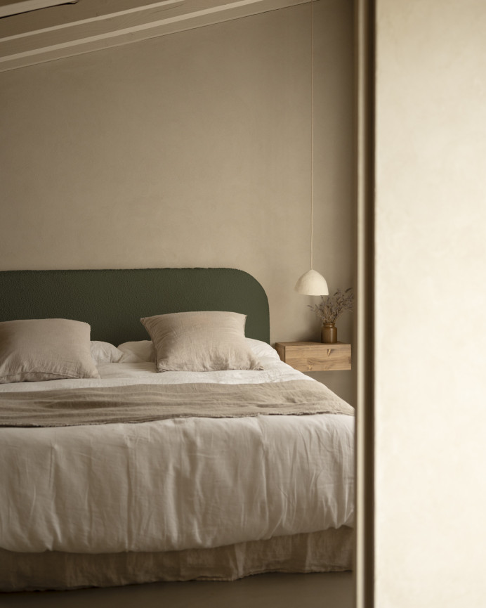 Upholstered headboard with removable cover in green bouclé fabric in various sizes.