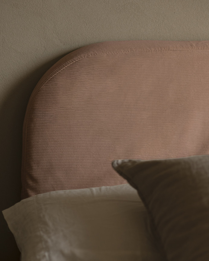 Upholstered headboard with removable coral corduroy cover, available in various sizes.