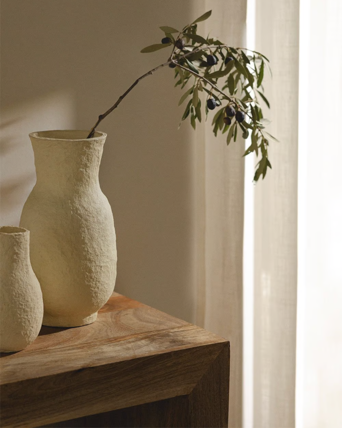 Beige paper mache vase measuring 31cm
