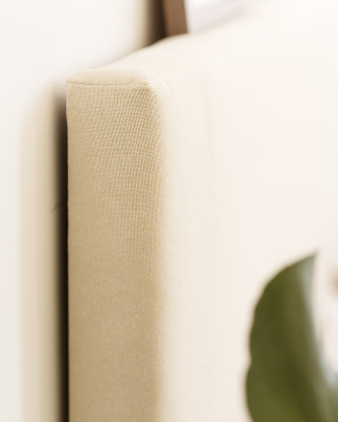 Upholstered cotton headboard in beige color available in various sizes.