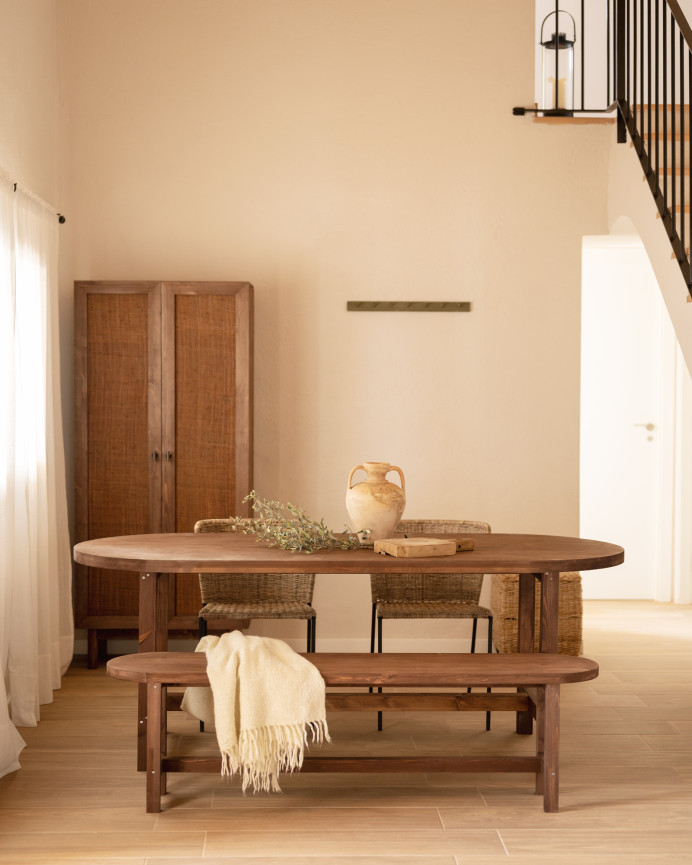 Oval solid wood dining table in walnut tone available in various sizes.