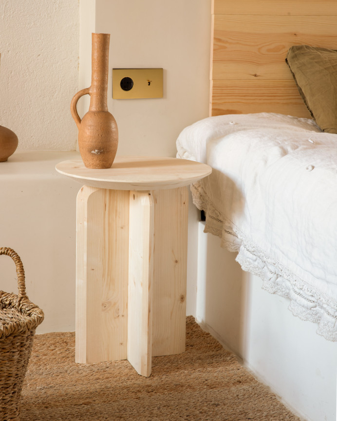 Solid wood side table in a natural tone measuring 50x45cm.