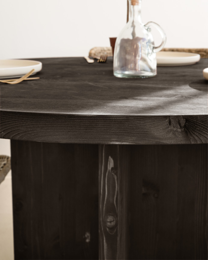 Round solid wood dining table in black tone with a diameter of 110cm