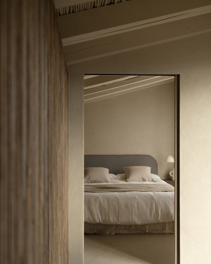 Removable dark gray bouclé upholstered headboard available in various sizes.