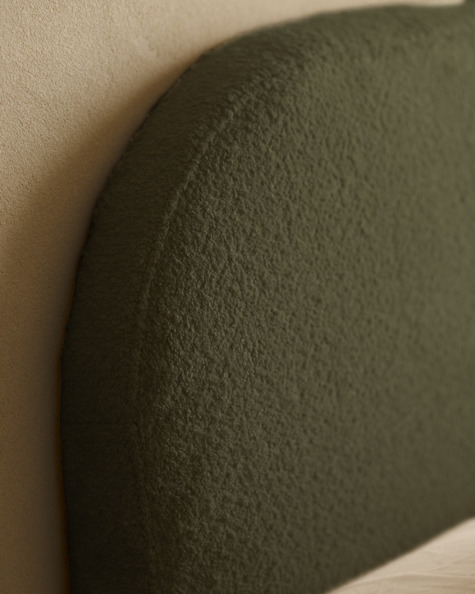 Upholstered headboard with removable cover in green bouclé fabric in various sizes.