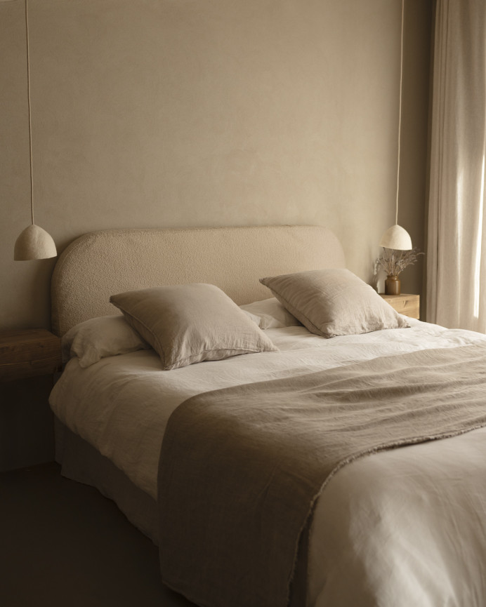 Beige bouclé headboard cover in various sizes.