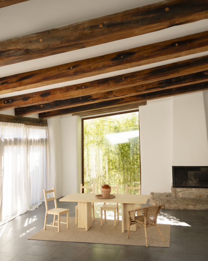 Solid wood dining table in a natural tone available in various sizes