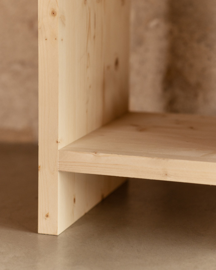 Solid wood bookcase in natural tone measuring 180x140cm.