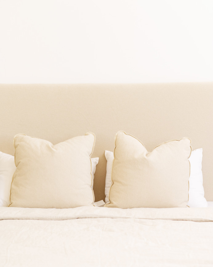 Upholstered cotton headboard in beige color available in various sizes.