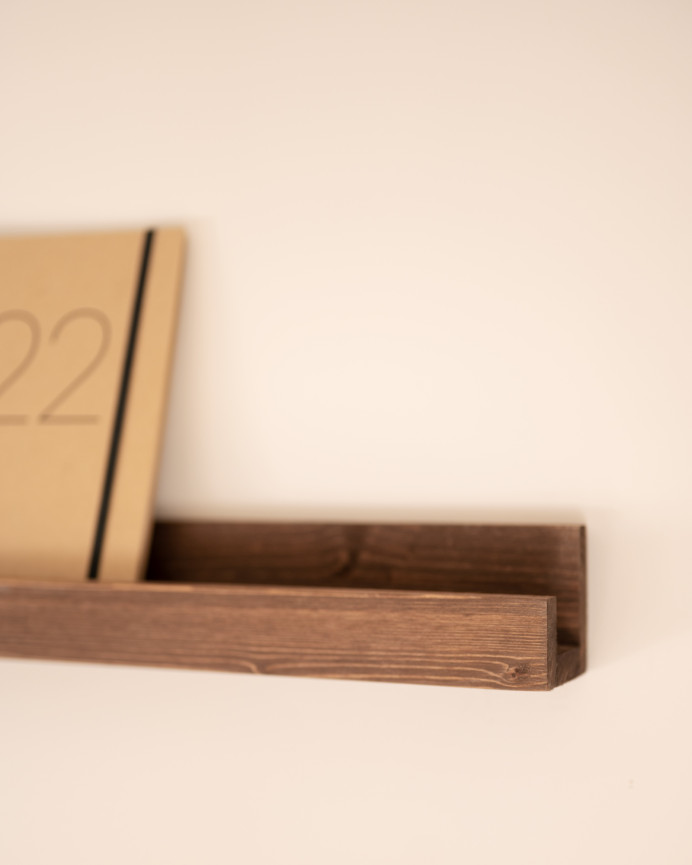 Solid walnut tone floating wooden shelf in various sizes.
