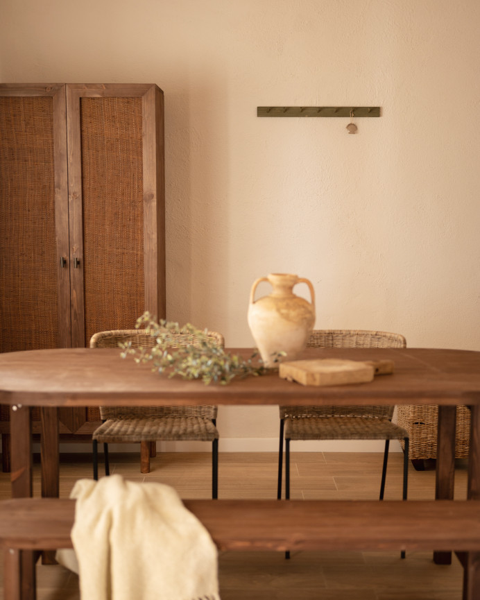 Oval solid wood dining table in walnut tone available in various sizes.