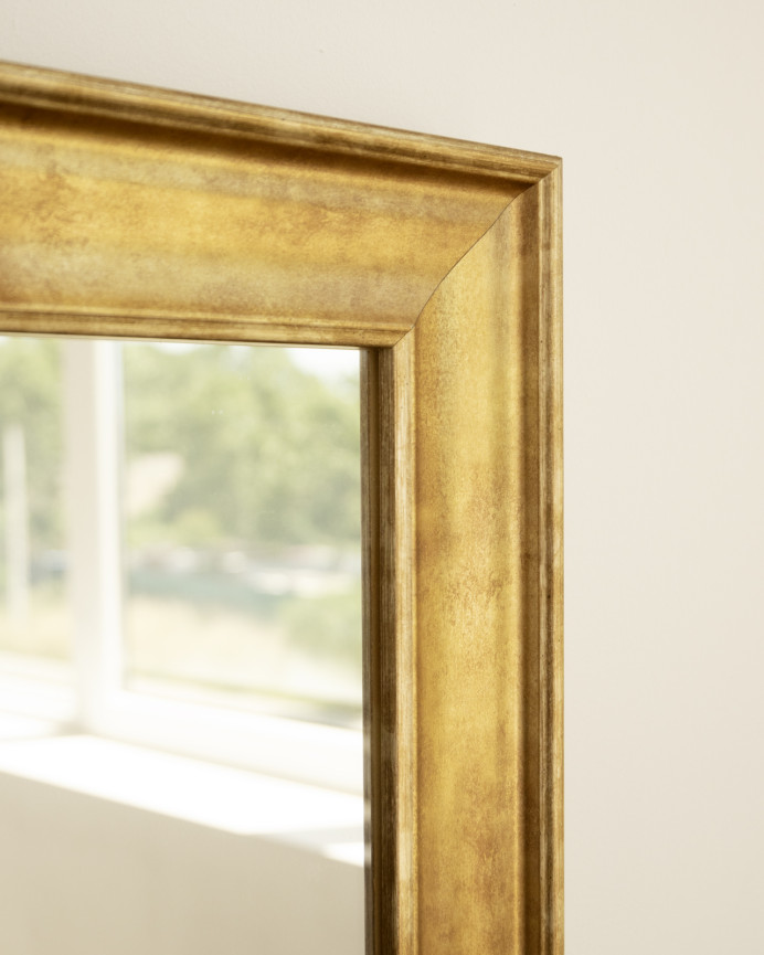 Solid wood mirror in a gold finish with a rectangular shape available in various sizes.