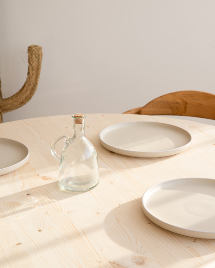 Solid wood round dining table in natural tone with a diameter of 110cm.