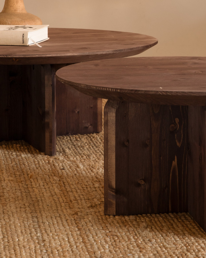 Round solid wood coffee table in walnut tone, available in various sizes.