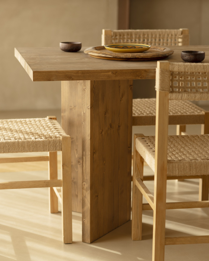 Solid wood dining table in dark oak tone available in various sizes.