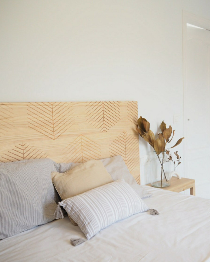 Solid wood headboard stamped with Hexagonal Leaves III pattern in natural tone of various sizes.