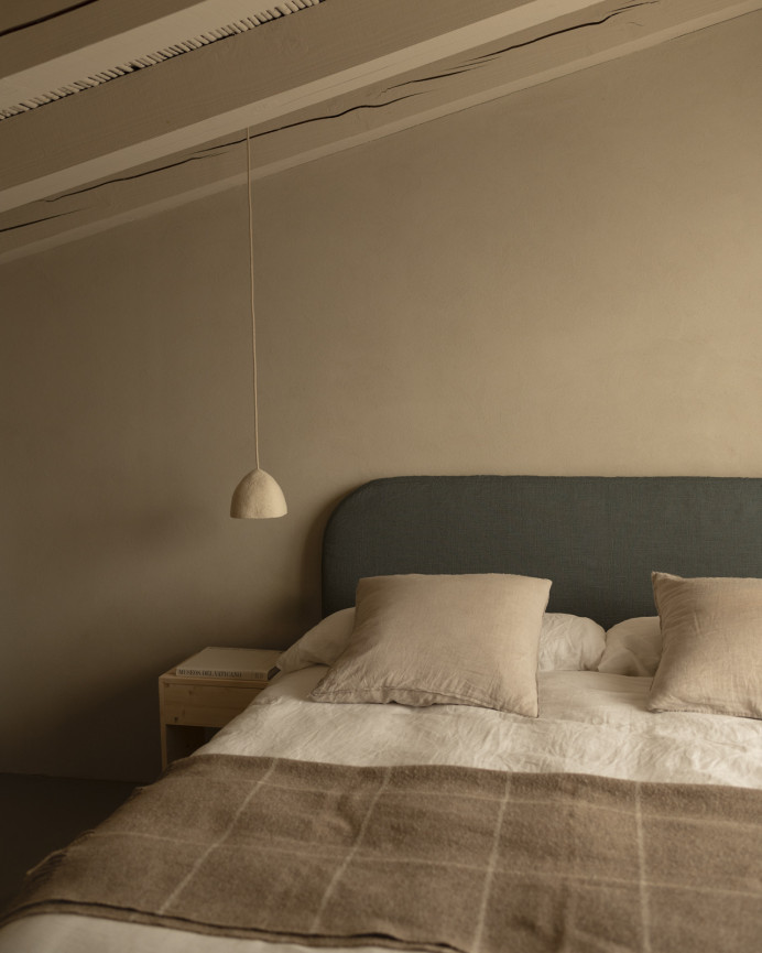 Upholstered blue linen headboard with removable cover, available in various sizes.