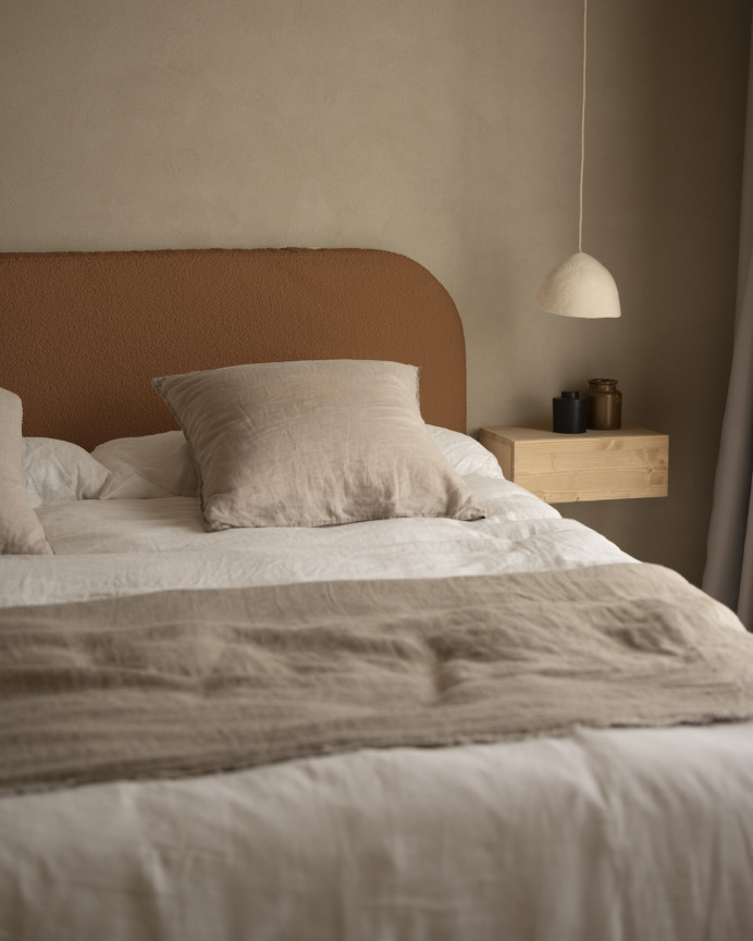 Upholstered headboard, removable cover in copper bouclé, available in various sizes.